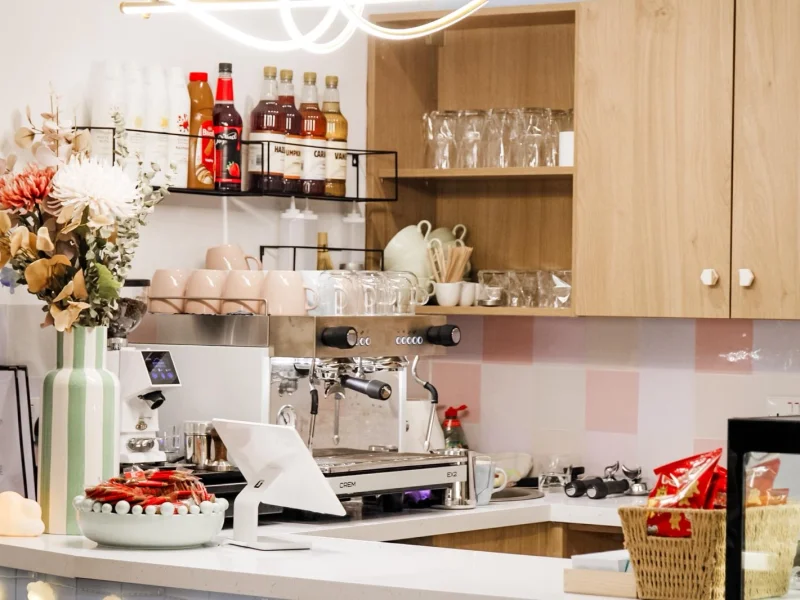 Parents enjoying coffee while children play safely